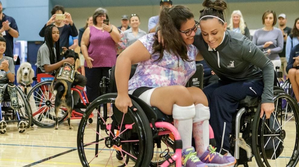 Olivia Curcuru presented with custom wheelchair at Angel City Games, 2019.