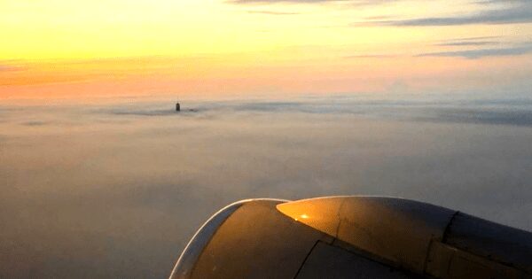Powerful 2018 photo of One World Trade Center poking through the clouds will inspire hope in you today.
