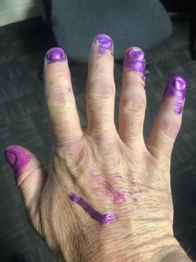 Firefighters calm scared little girl down after car crash by letting her paint their nails. Credit: North Davis Fire District