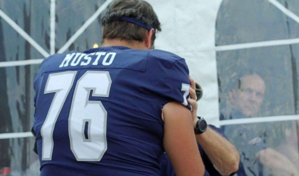 College football player surprises his stepdad by changing his last name on jersey.
