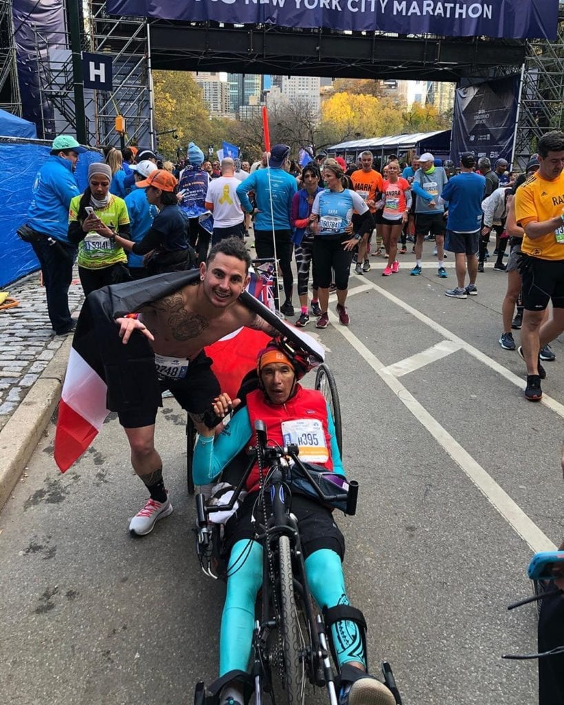 Runner who flew from New Zealand for the NYC Marathon stops halfway to help disabled racer cross the finish line