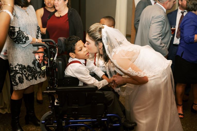 Teacher who was deeply impacted by three of her special needs students invited them to be in her wedding