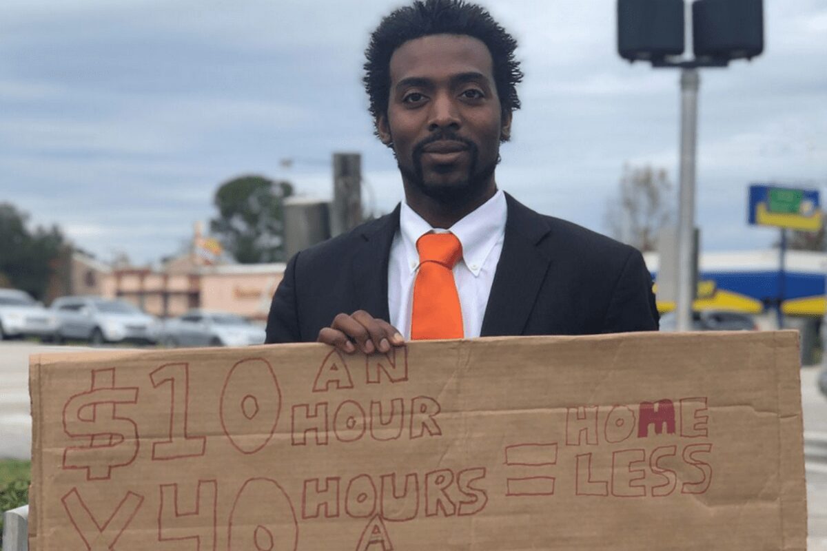 Florida man hands out resumes on the street, turning down cash and saying he wants a career more than money.