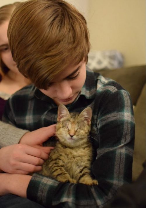 Blind kitten who was abandoned in a pile of trash, finds her fur-ever home with a family of adopted kids.