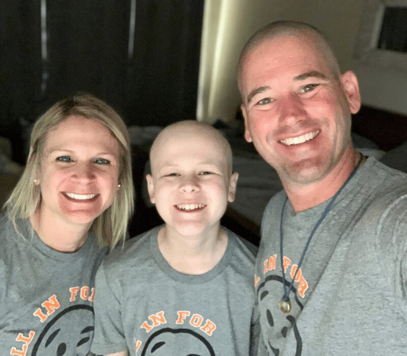 Lori, Aiden and Chuck pose for a family photo.