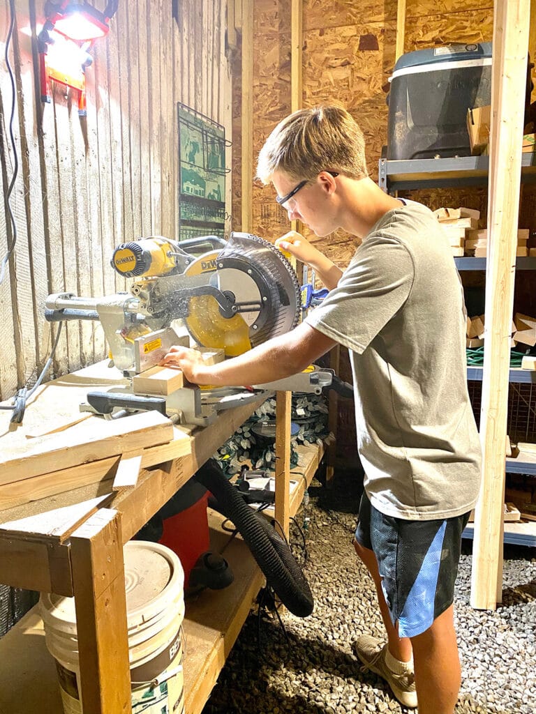 Colby building desks for underprivileged kids.