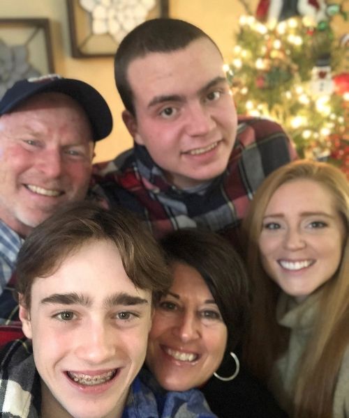 Ryan is seen in this photo with his parents, Tracy and Rob Lowry and siblings Madison Lowry, 26 and Carson, 14.