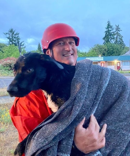 Oregon firefighters rescue injured dog from drowning and reunite the pup with his owners.