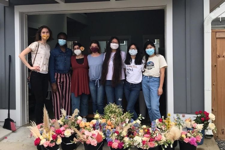 Team of volunteers at The Simple Sunflower pose for a photo.