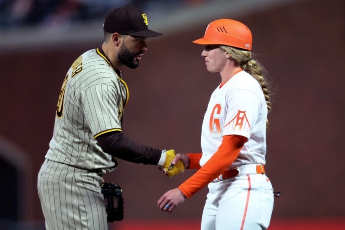 Alyssa Nakken makes MLB history as the first woman to coach on the field during a regular season game.