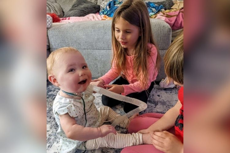 Bradi Foster plays with her sisters after going home from NICU.