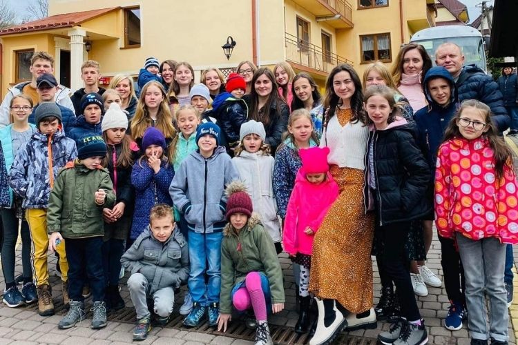 Missouri mom travels halfway across the globe to help 31 orphans escape from Ukraine and find homes.