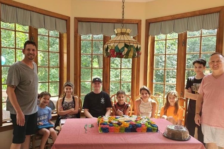 Two dads adopt 6 siblings who spent 5 years in foster care just so they could stay together.
