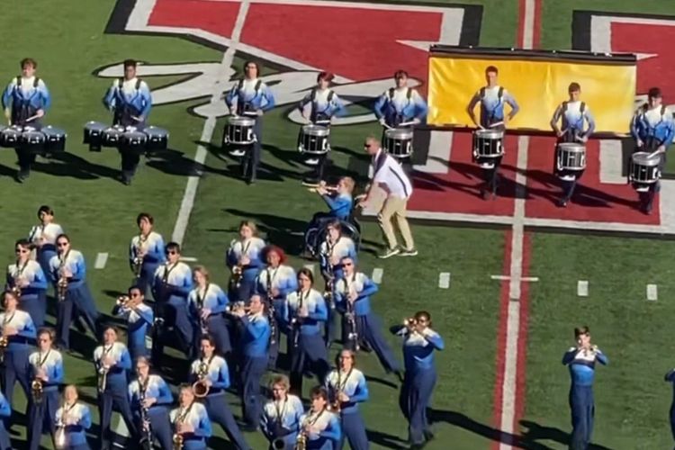 High school band director helps student in wheelchair live his marching band dreams.