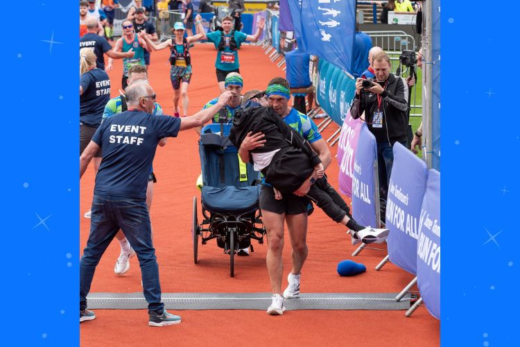 Rugby League star carried over Marathon finish line by former teammate